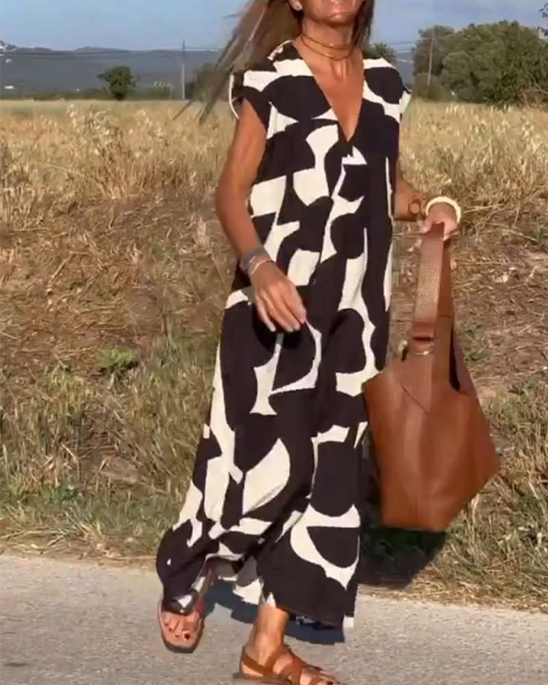 NAOMI | Lange Geprinte Jurk met V-hals en Uitlopende Pasvorm voor een Vakantielook